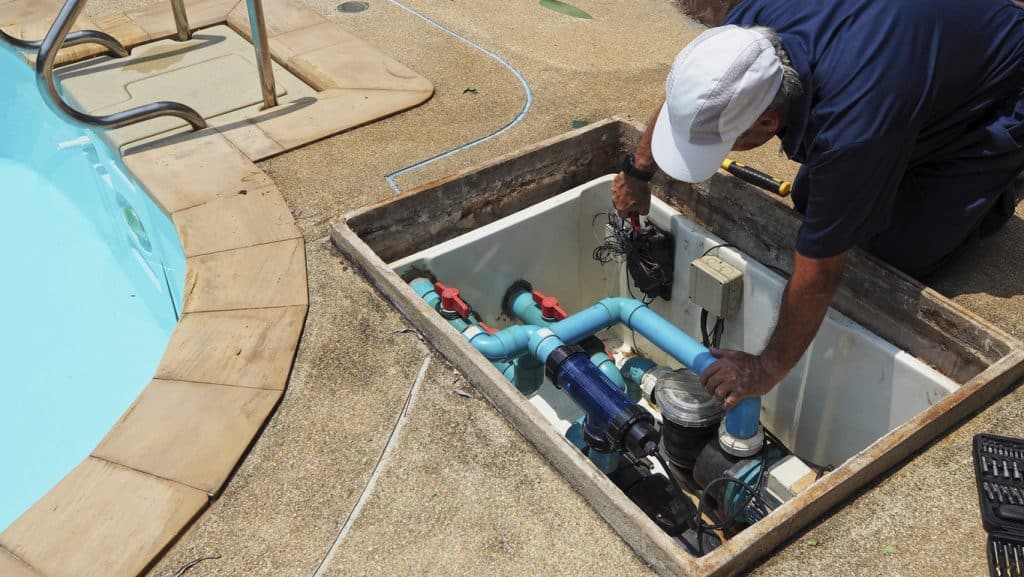 Technician fixing swimming pool